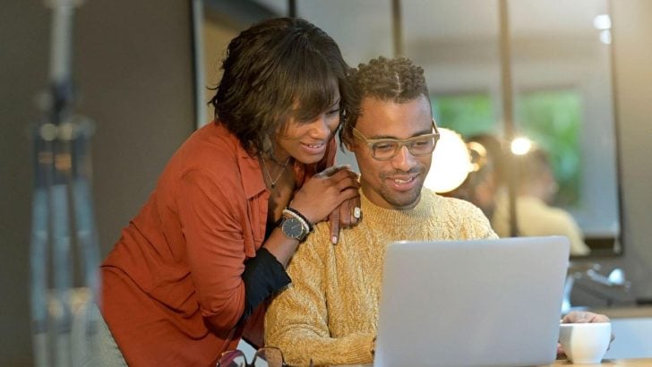 couple browsing for disability insurance on the laptop